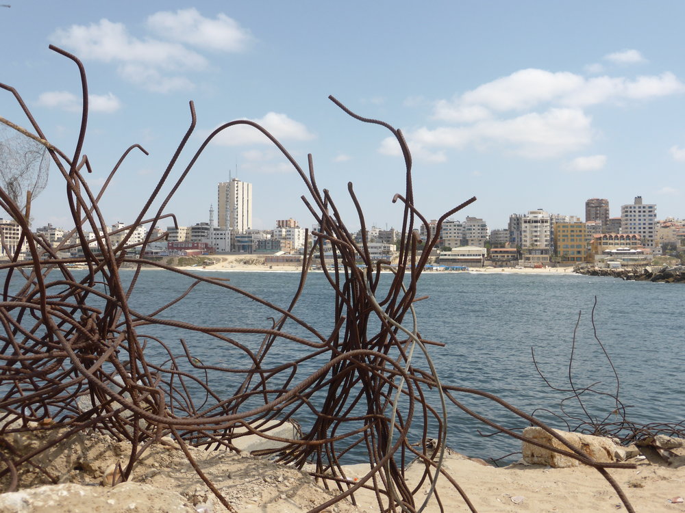 Standing on the breakwater, and looking back towards Gaza City and the shoreline.